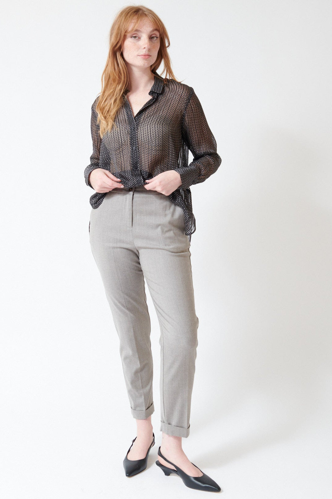 Waverly wearing Rosso 35 Cuffed Stretch Back Pant in Mushroom Melange, front view with the shirt lifted to see the full front.