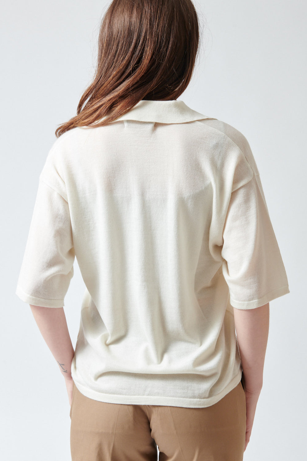 Sophie wearing SPRWMN Short Sleeve Oversized Polo rear view