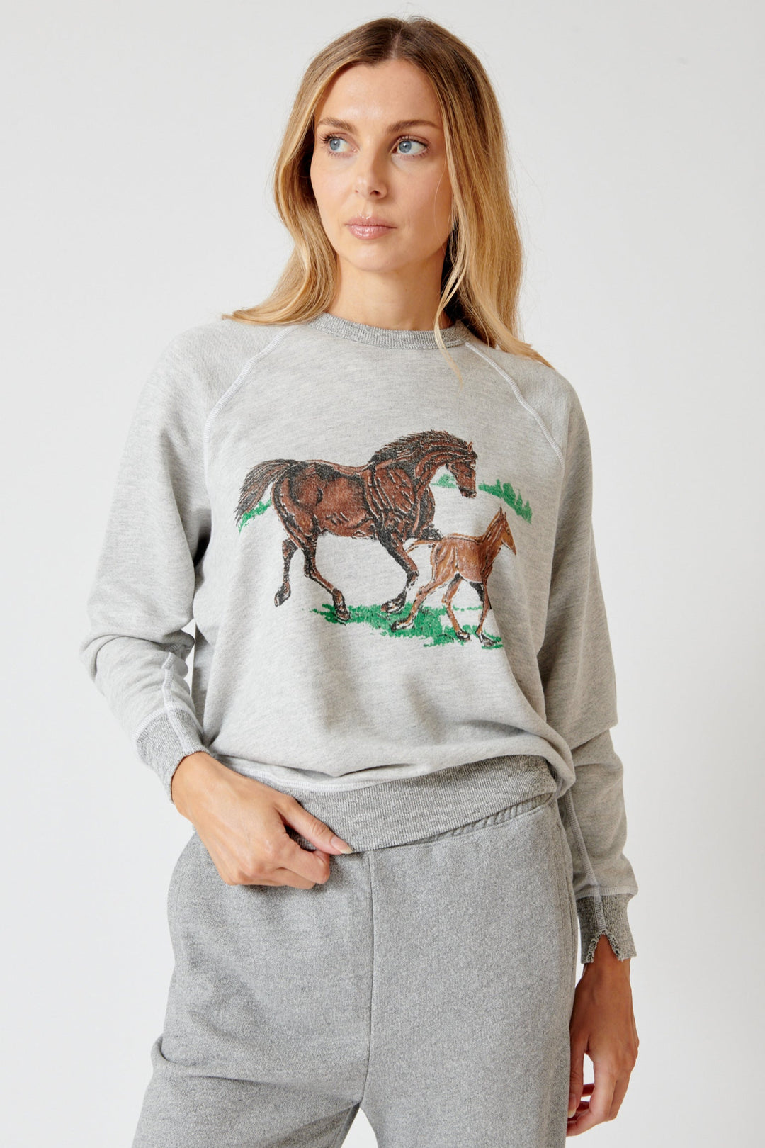 Mari wearing The Great The College Sweatshirt w/ Running Horses front view