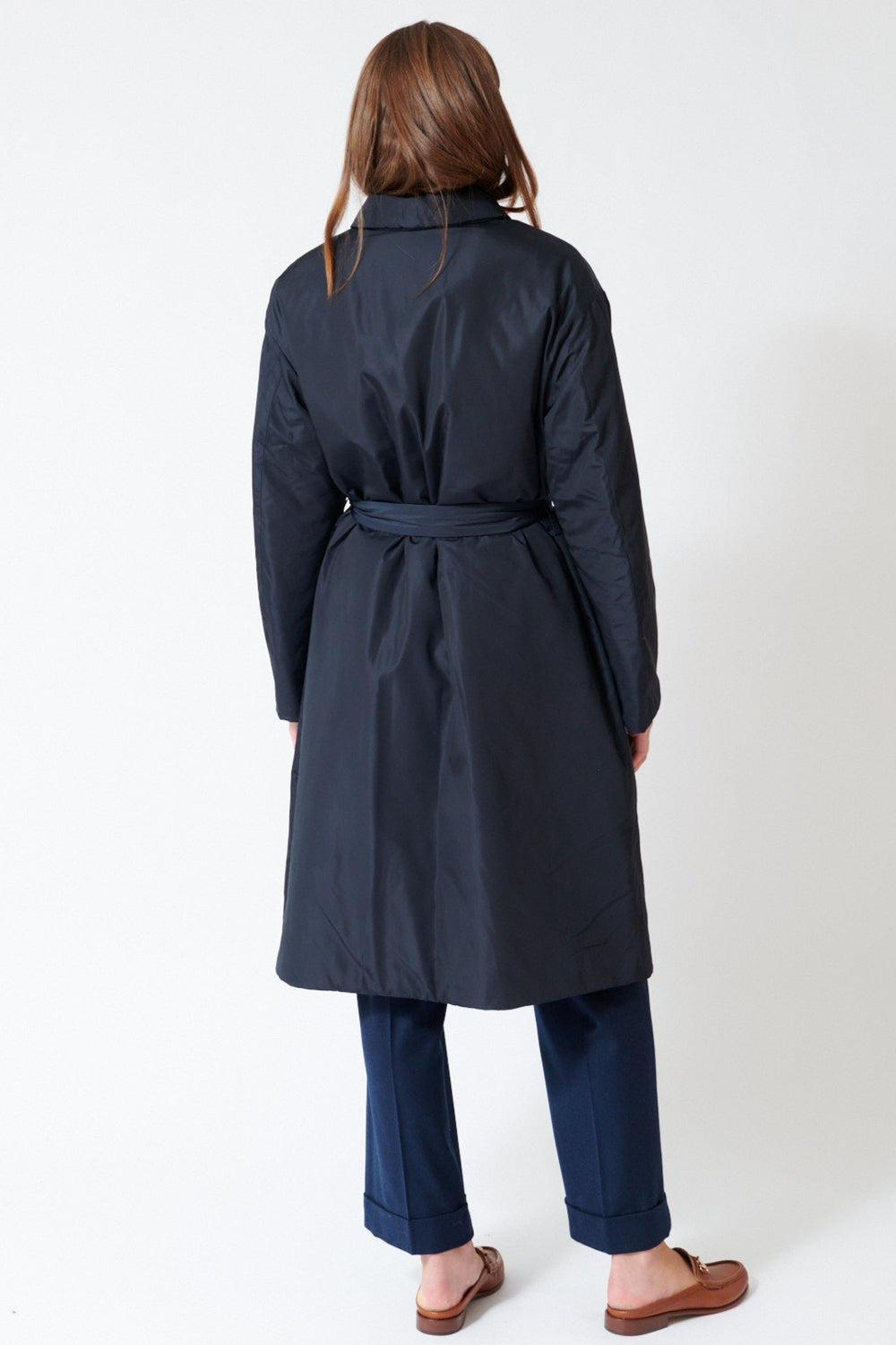 Julia wearing Rosso 35 Thermore Insulated Trench Coat in Deep Blue, rear view.