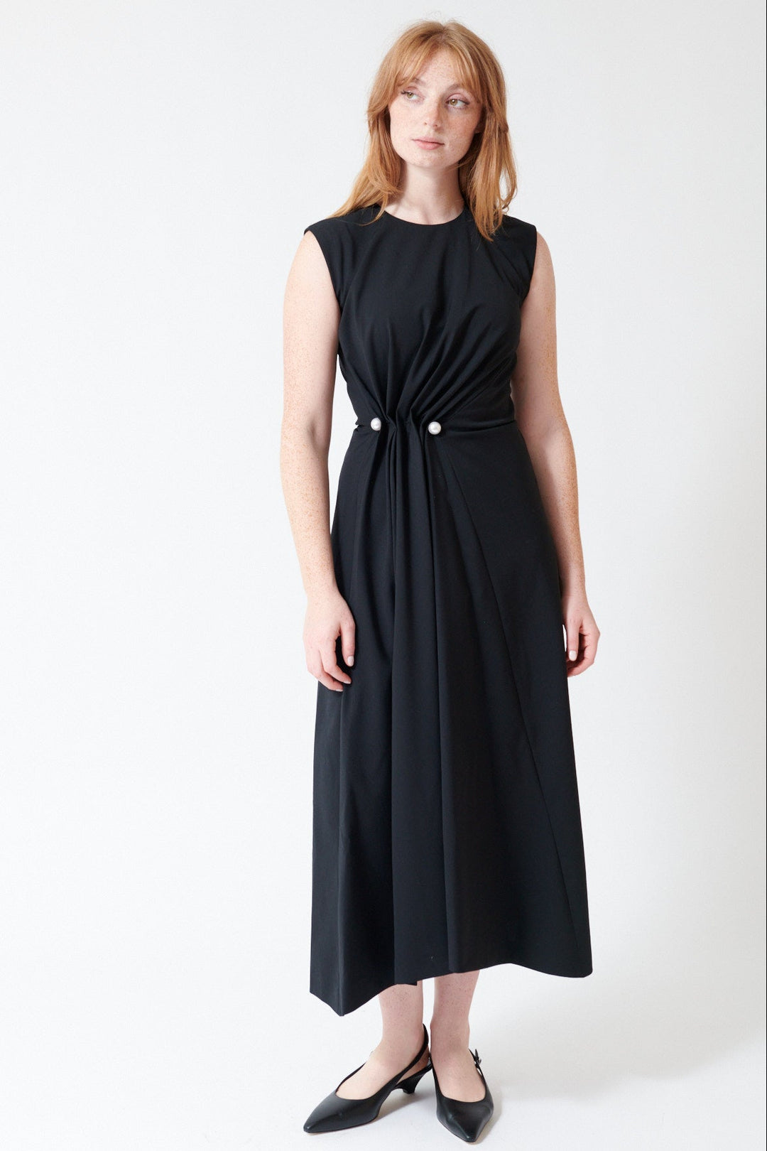 Waverly wearing Mantu Fresco Lana Side Gathered Dress in Black, front view.