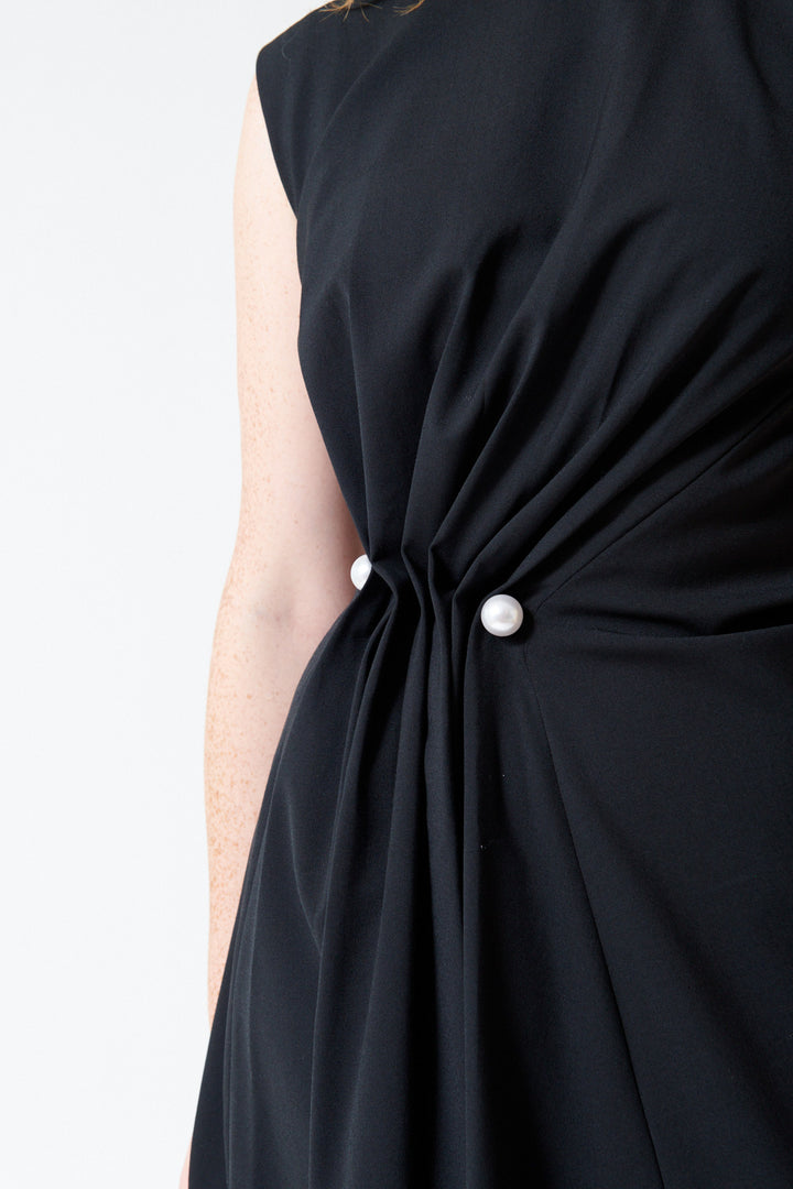 Close up of front gather on Mantu Fresco Lana Side Gathered Dress in Black.