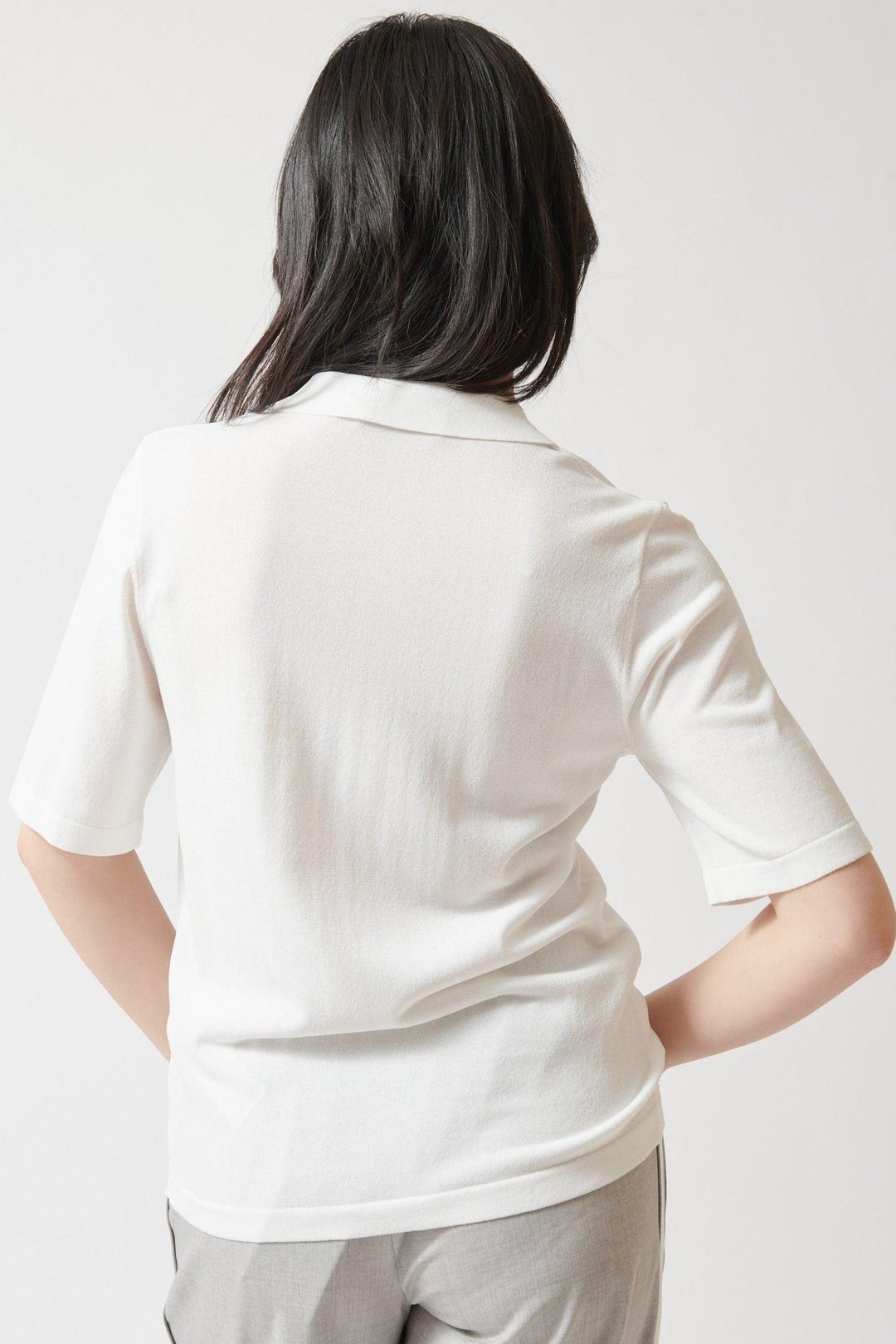 Lilly wearing Seventy Emblazoned Knit Polo rear view