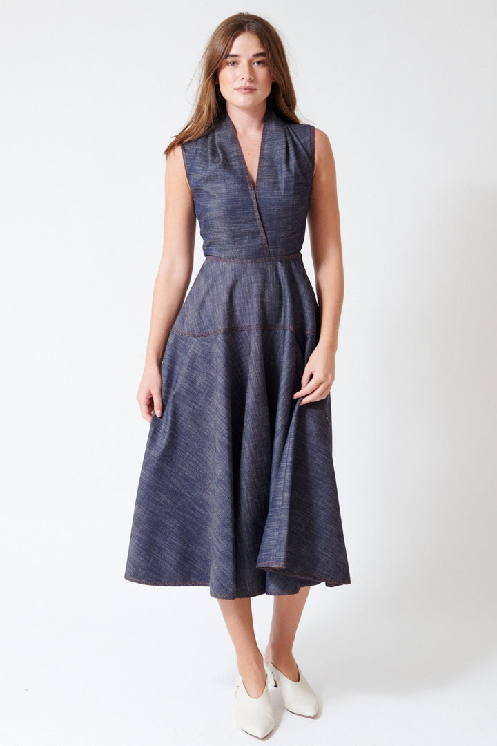 Julia wearing Mantu Effetto Denim Sleeveless Dress in Night Blue, alternate front view.