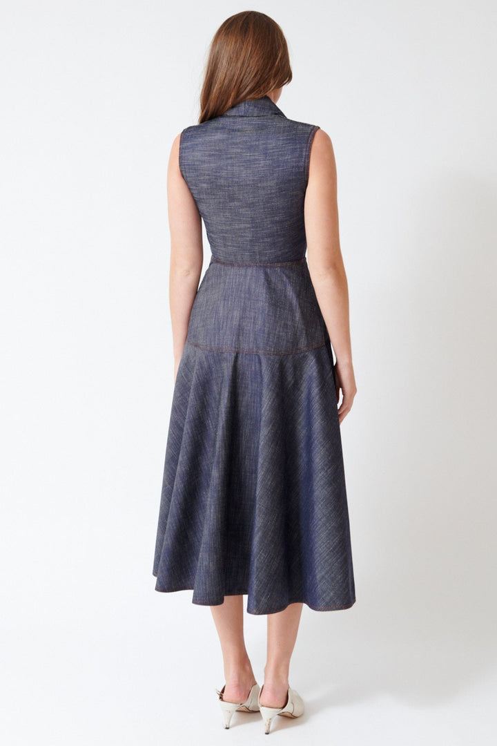 Julia wearing Mantu Effetto Denim Sleeveless Dress in Night Blue, rear view.