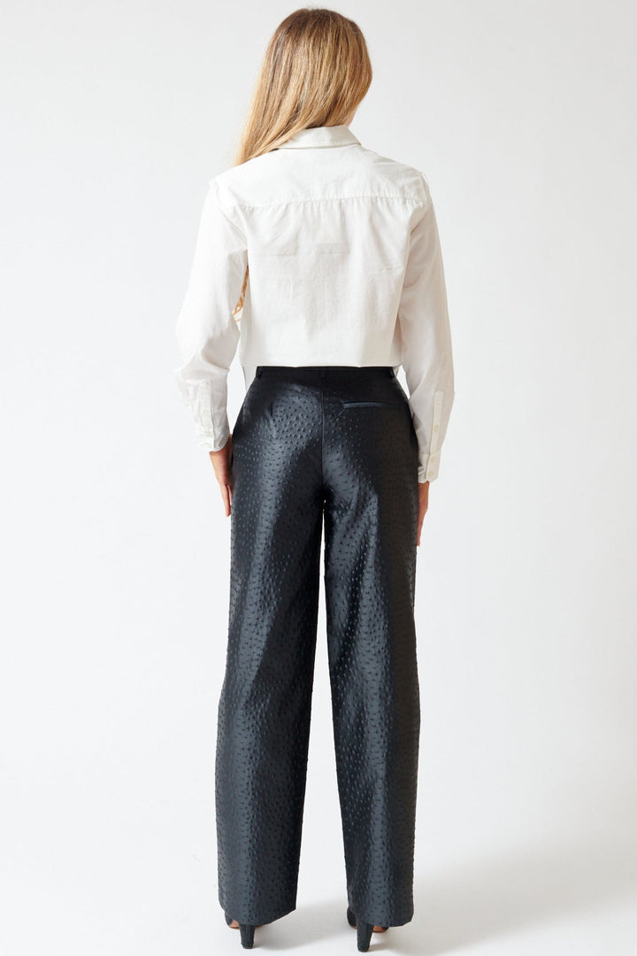 Mari wearing Róhe Ostrich Satin Trousers rear view