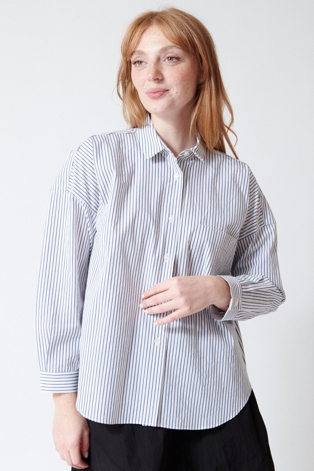 Waverly wearing Fabiana Pigna Egu Italian Stripe Cotton Blouse in Navy Stripe, front view.