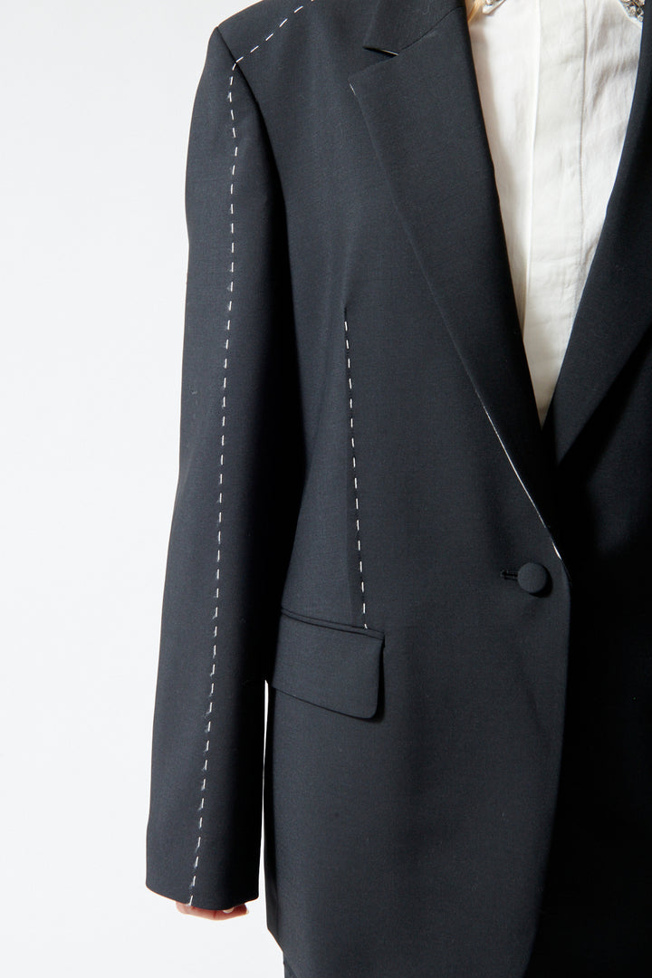 Mari wearing Róhe Contrast Detail Blazer front/detail view