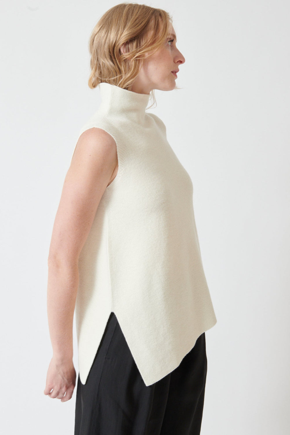 Madi wearing Christian Wijnants Kalixa Knit Top side/front view