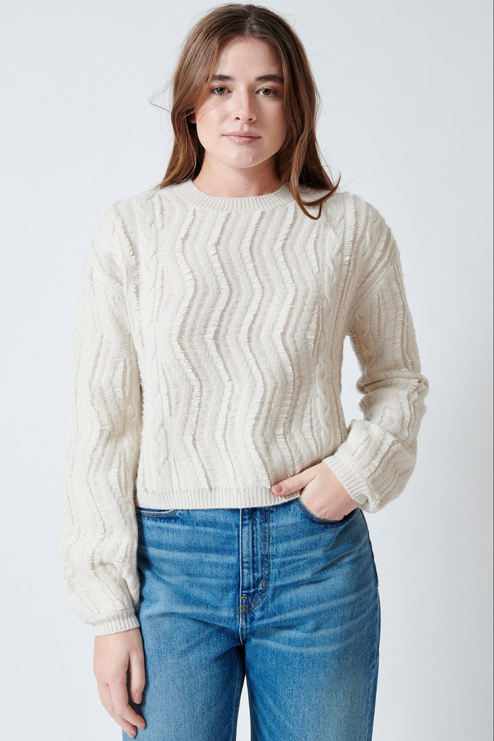 Julia wearing Jumper 1234 Raw Cut Cable Crew front view