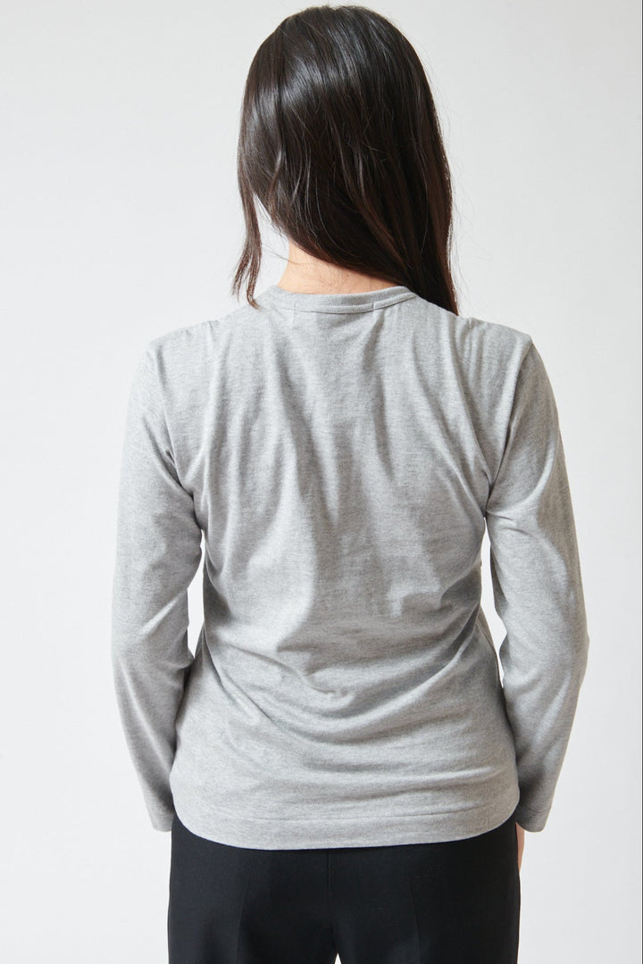 Lilly wearing Comme des Garçons PLAY Duo Pair Heart Logo Print Long Sleeve T-Shirt rear view