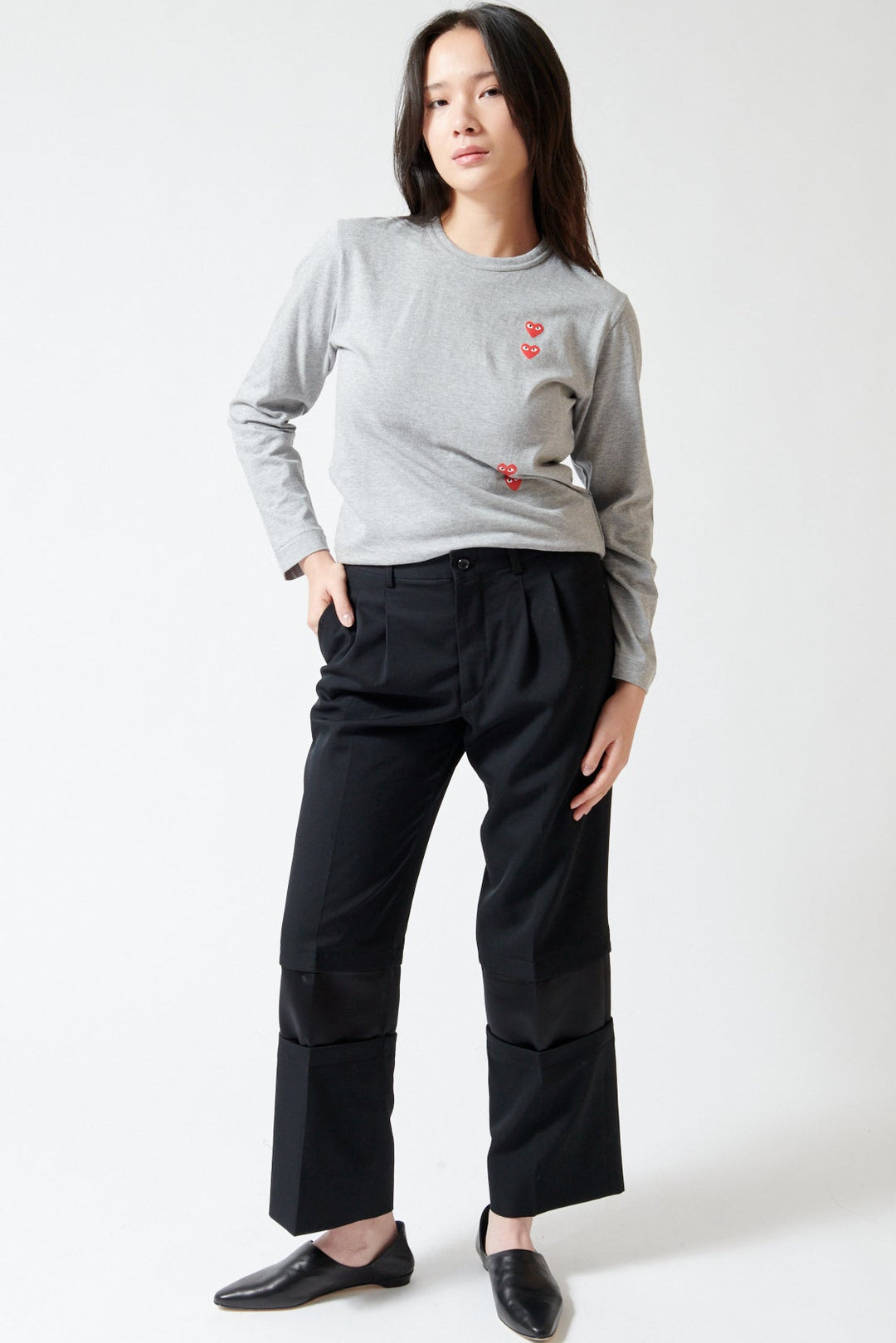 Lilly wearing Comme des Garçons Wool Gabardine x Poly Satin Banded Leg Trouser front view