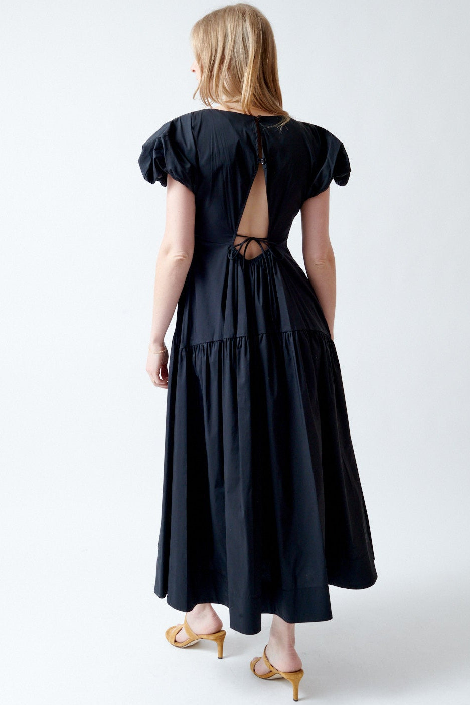 Madi wearing Meimeij Short Puff Sleeve Long Dress rear view