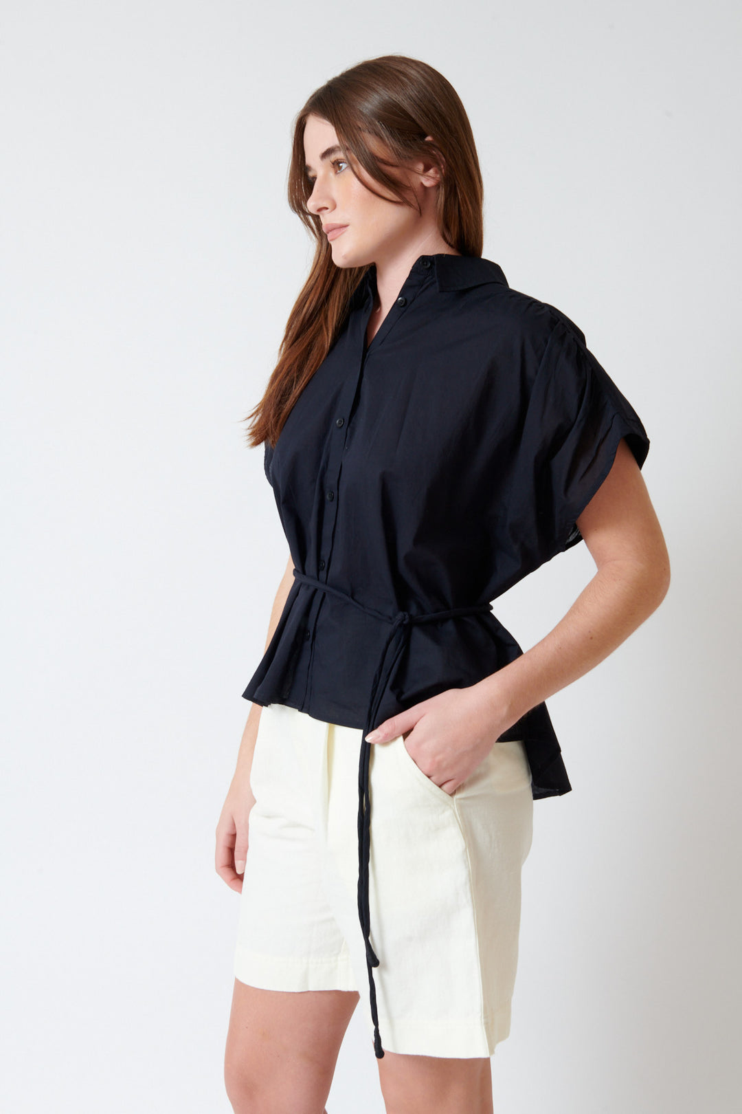 Julia wearing Apiece Apart Agni Floaty Top front/side view