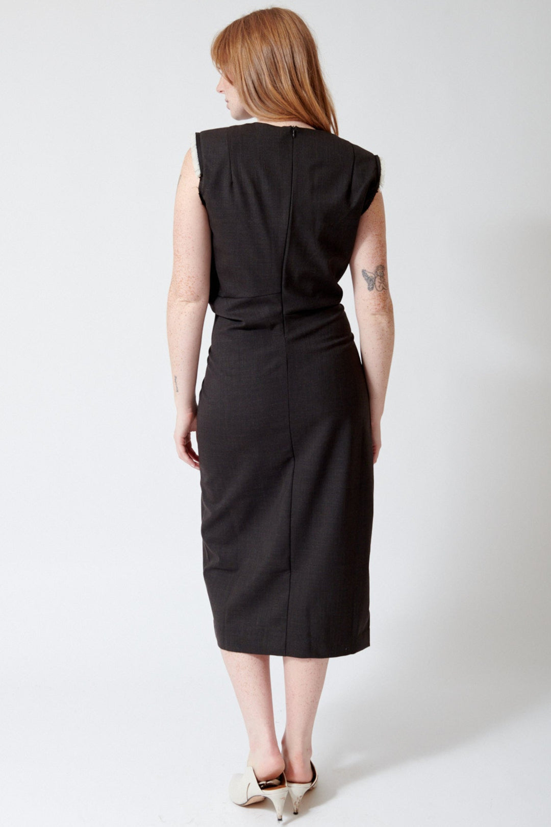 Waverly wearing Meimeij Raw Edge Sleeveless Gathered Dress rear view
