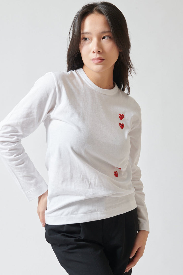 Lilly wearing Comme des Garçons PLAY Duo Pair Heart Logo Print Long Sleeve T-Shirt front view