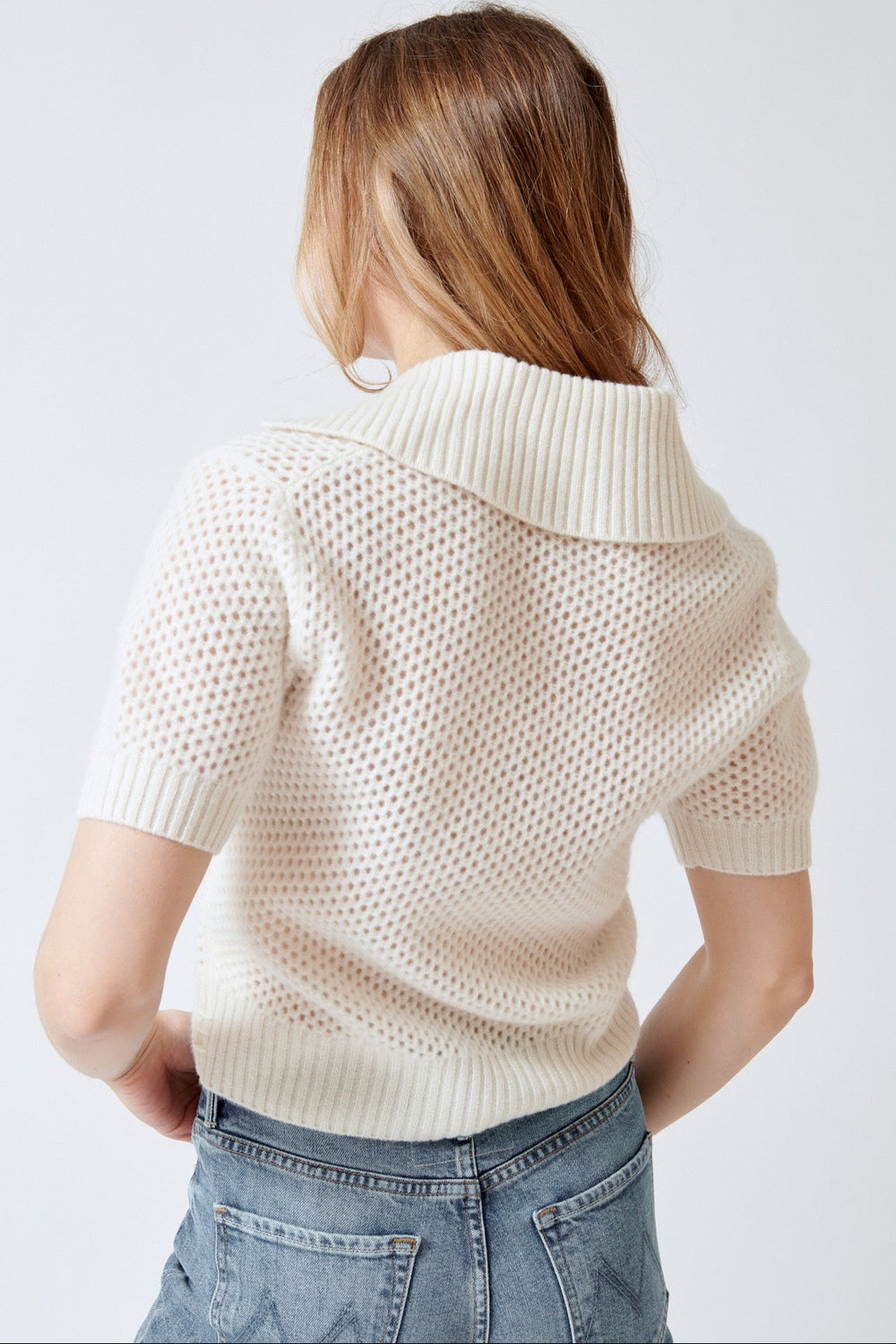 Madi wearing White + Warren Cashmere Mesh Polo rear view