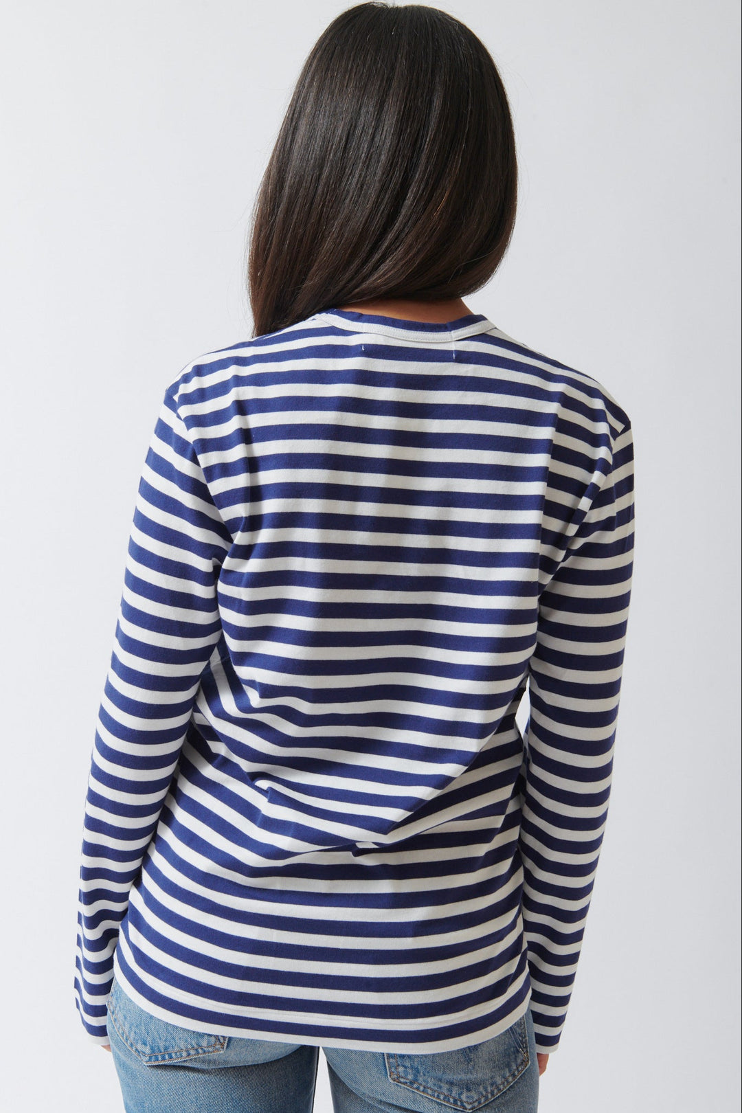 Amanda wearing Comme des Garçons PLAY Red Heart Emblem Striped Long Sleeve Tee Navy White rear view