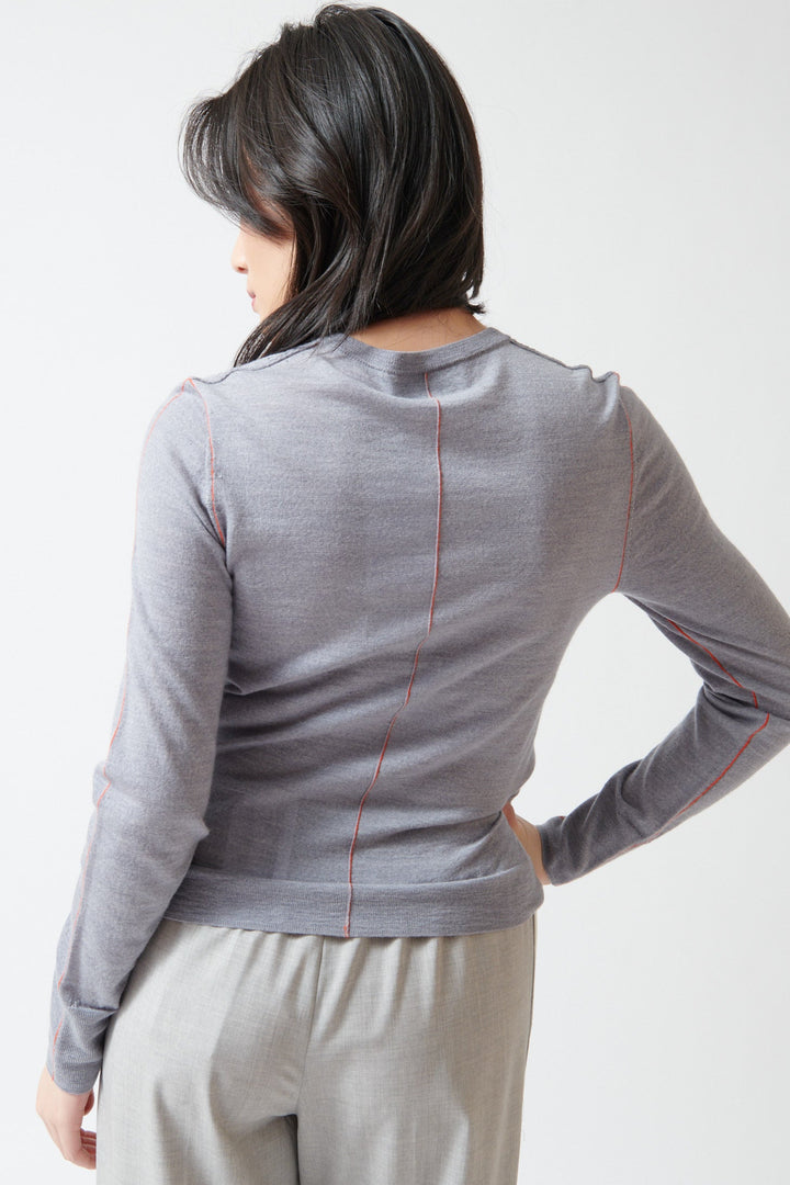 Lilly wearing WE-AR4 The Core Cardigan rear view