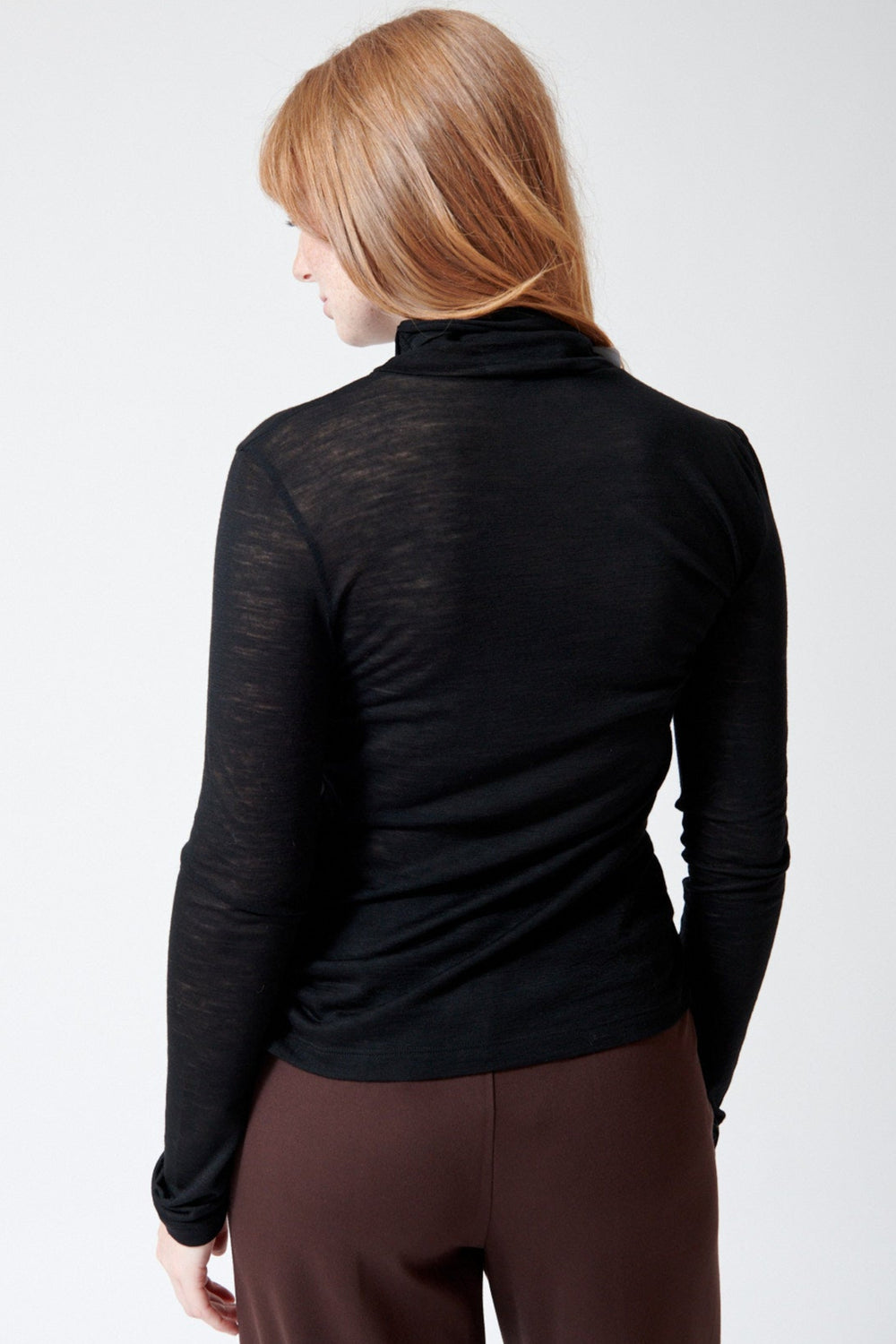 Waverly wearing Meimeij Sheer Lightweight T Neck T Shirt rear view