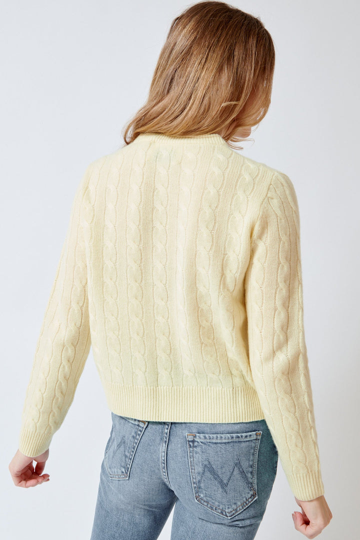 Mari wearing White + Warren Cashmere Varsity Cable Crewneck rear view