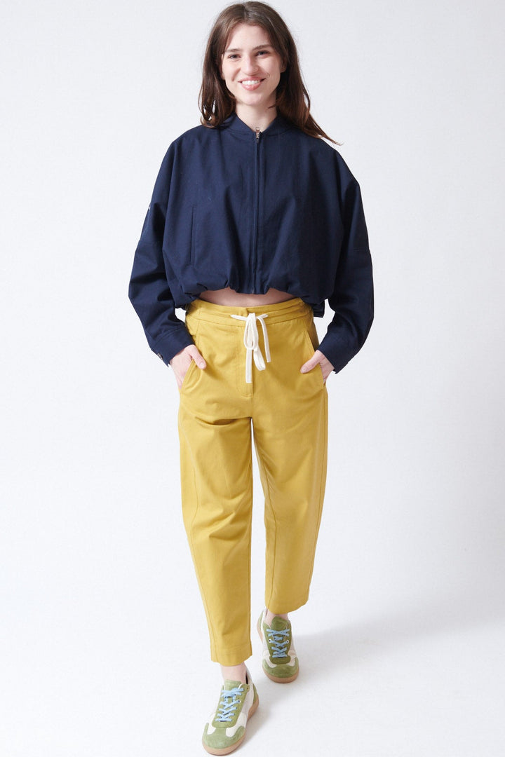 Sophie wearing Tela Disco Trousers front view