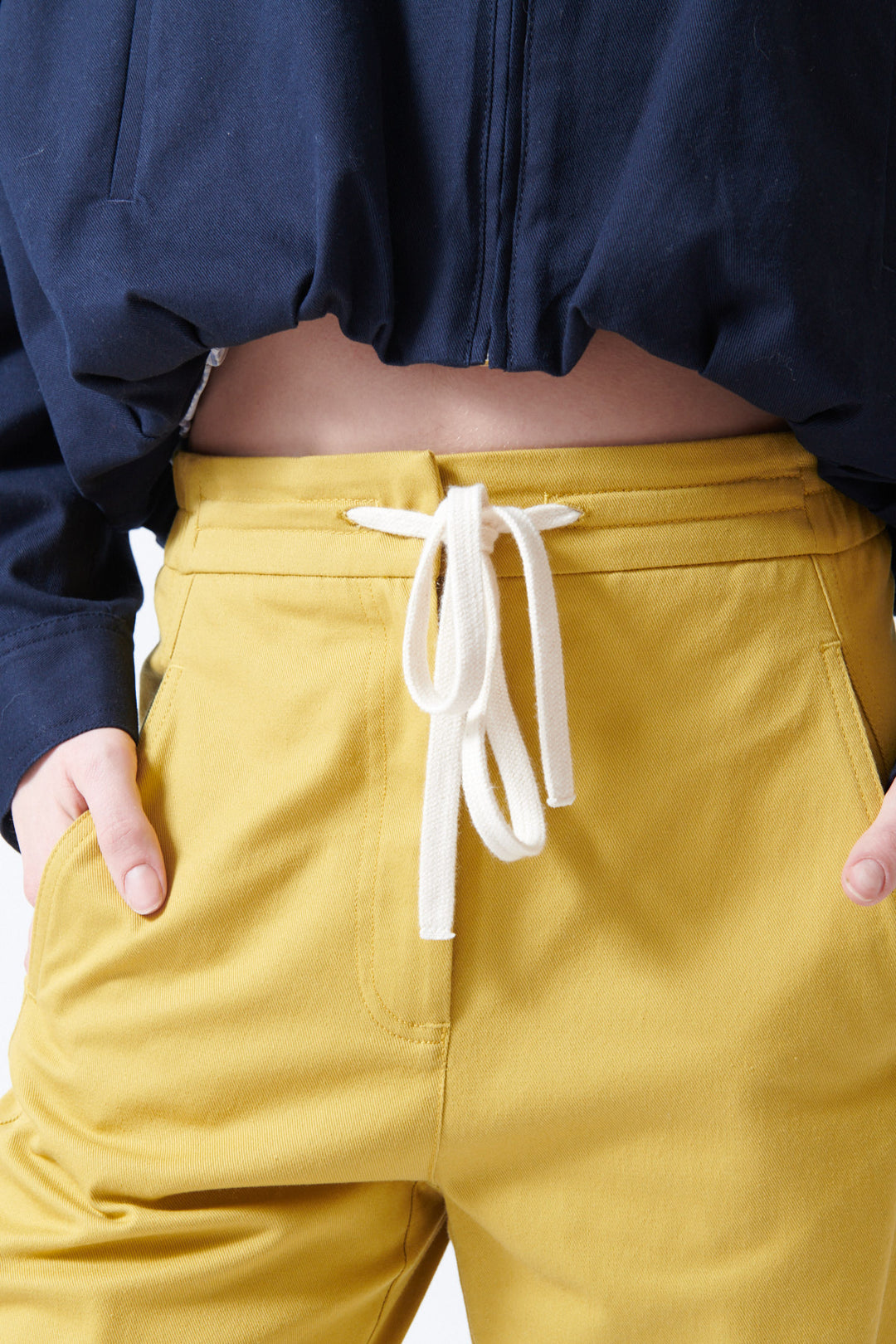 Sophie wearing Tela Disco Trousers front/detail view