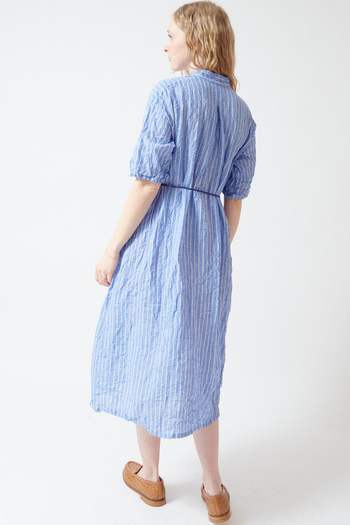 Madi wearing Pas de Calais Blue Shirring Stripe Dress rear view