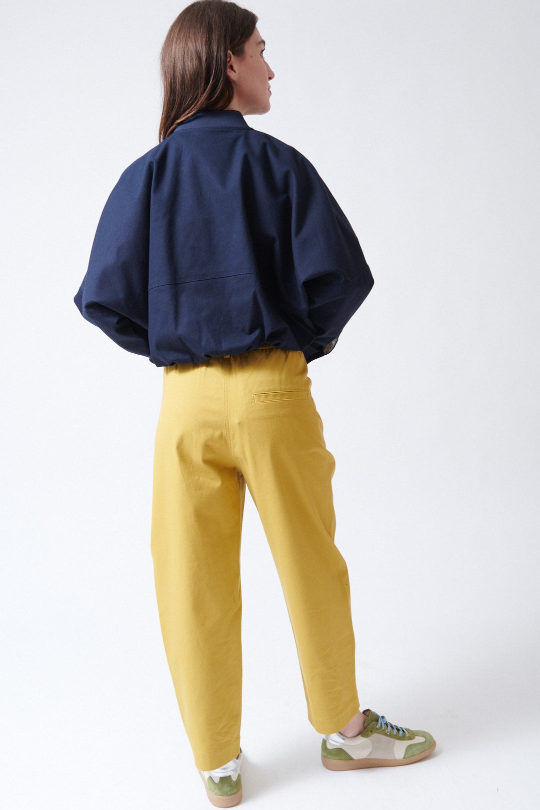 Sophie wearing Tela Disco Trousers rear view