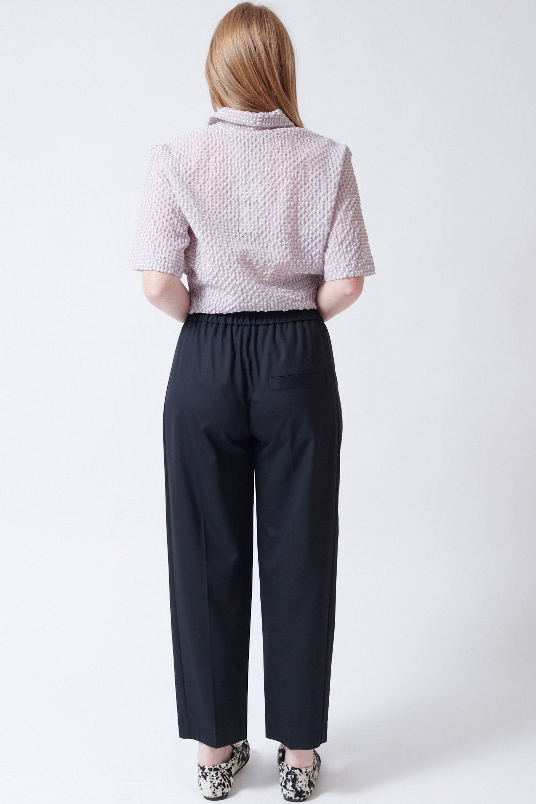 Waverly wearing Tela Kilo Trousers rear view