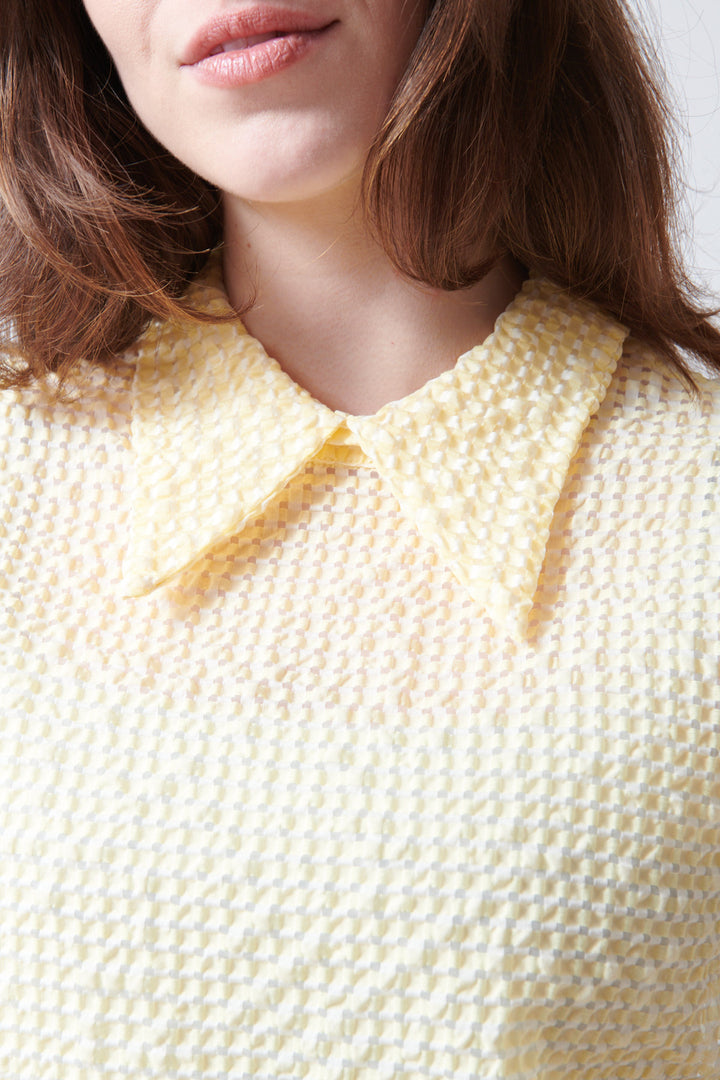 Sophie wearing Tela Oslo Top front/detail view