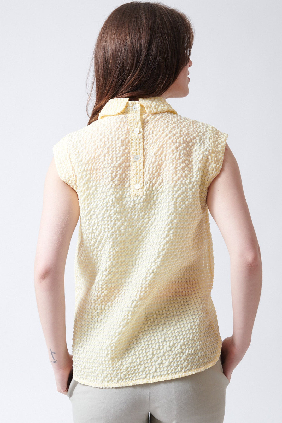 Sophie wearing Tela Oslo Top rear view