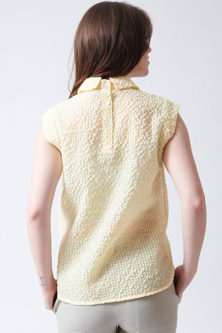 Sophie wearing Tela Oslo Top rear view