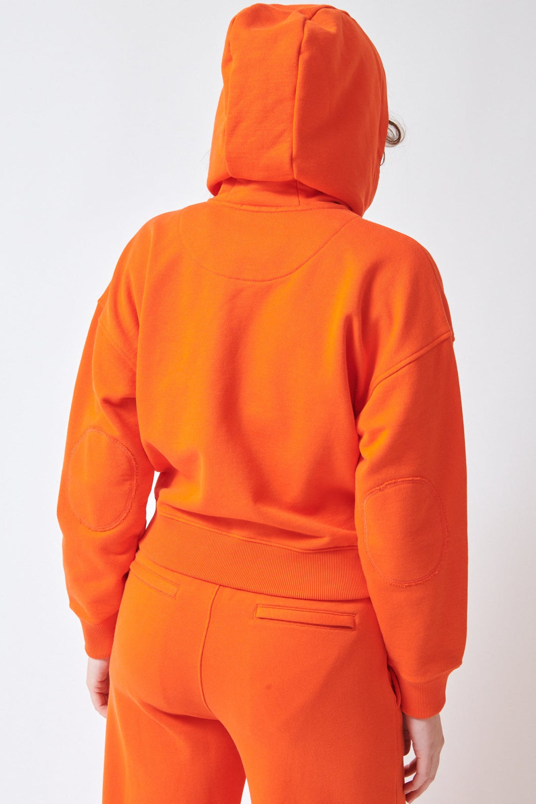 Julia wearing ATM Anthony Thomas Melillo Cotton Cropped Zip Up Zip Down Hooded Sweatshirt rear view