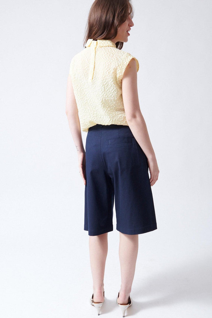 Sophie wearing Tela Lake Bermudas rear view