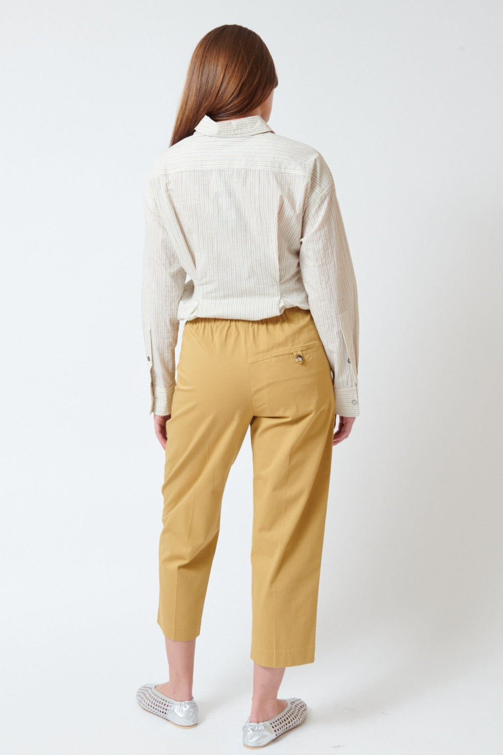 Julia wearing Tela Ace Trousers rear view