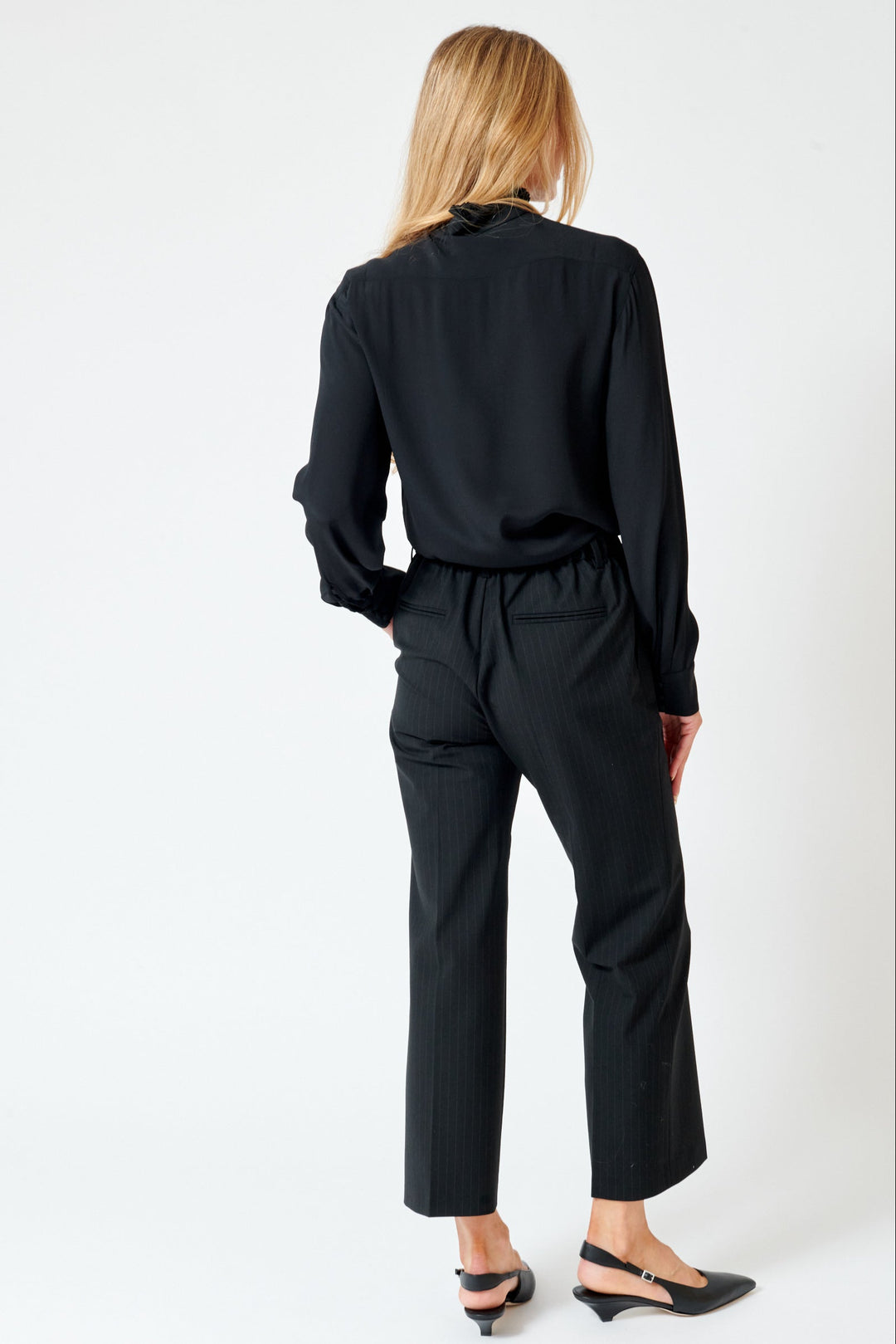 Mari wearing N°21 Elastic Back Pinstripe Trouser rear view