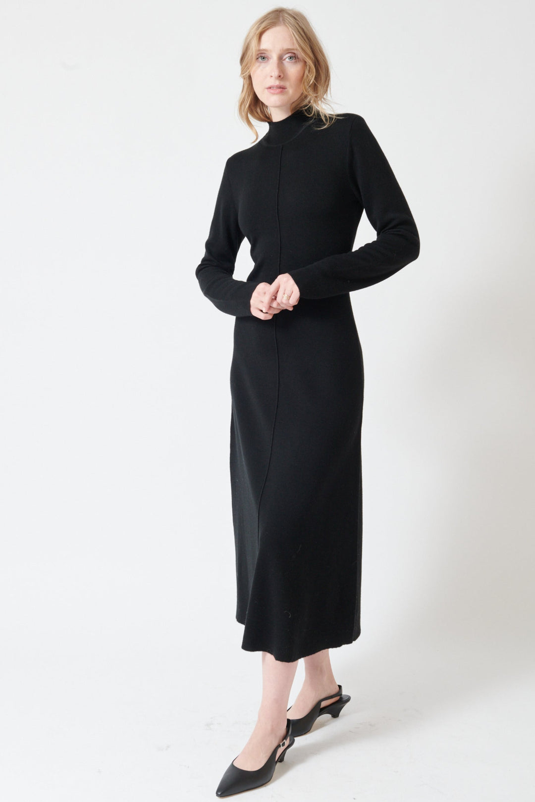 Madi wearing Seventy Long Knit Center Seam High Neck Dress front view