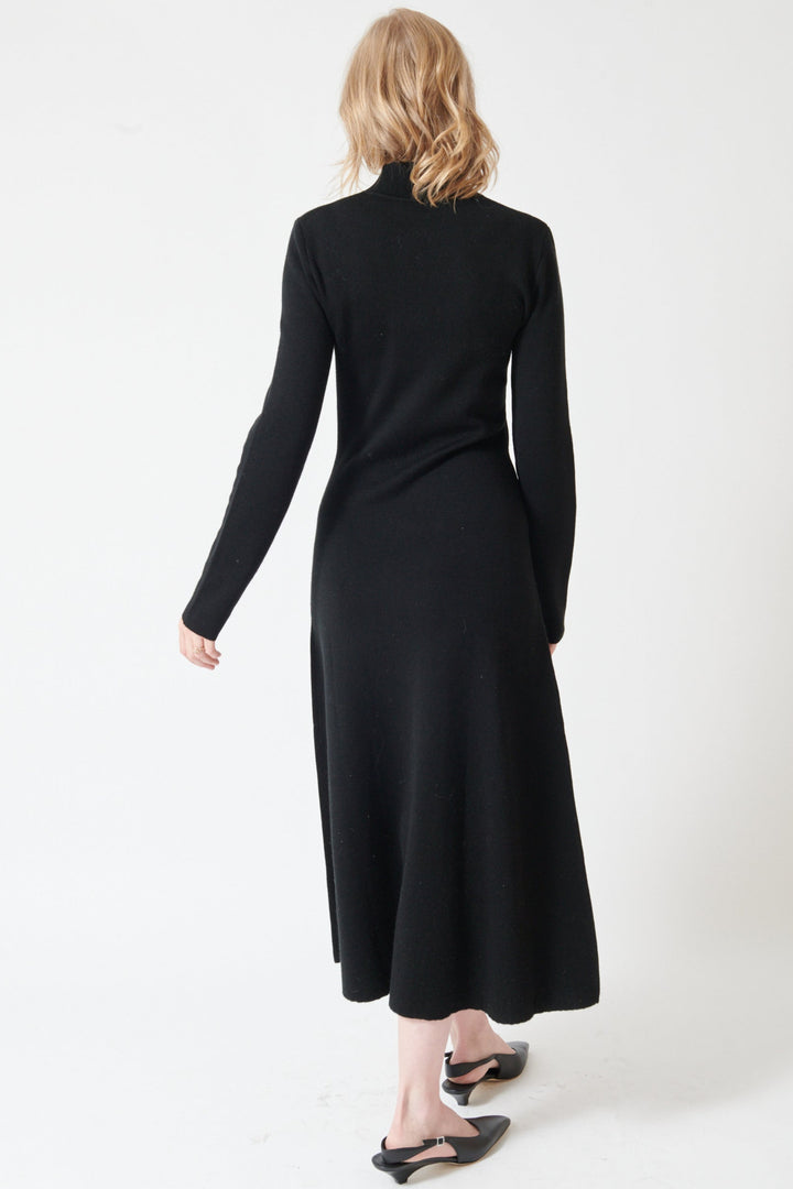 Madi wearing Seventy Long Knit Center Seam High Neck Dress rear view