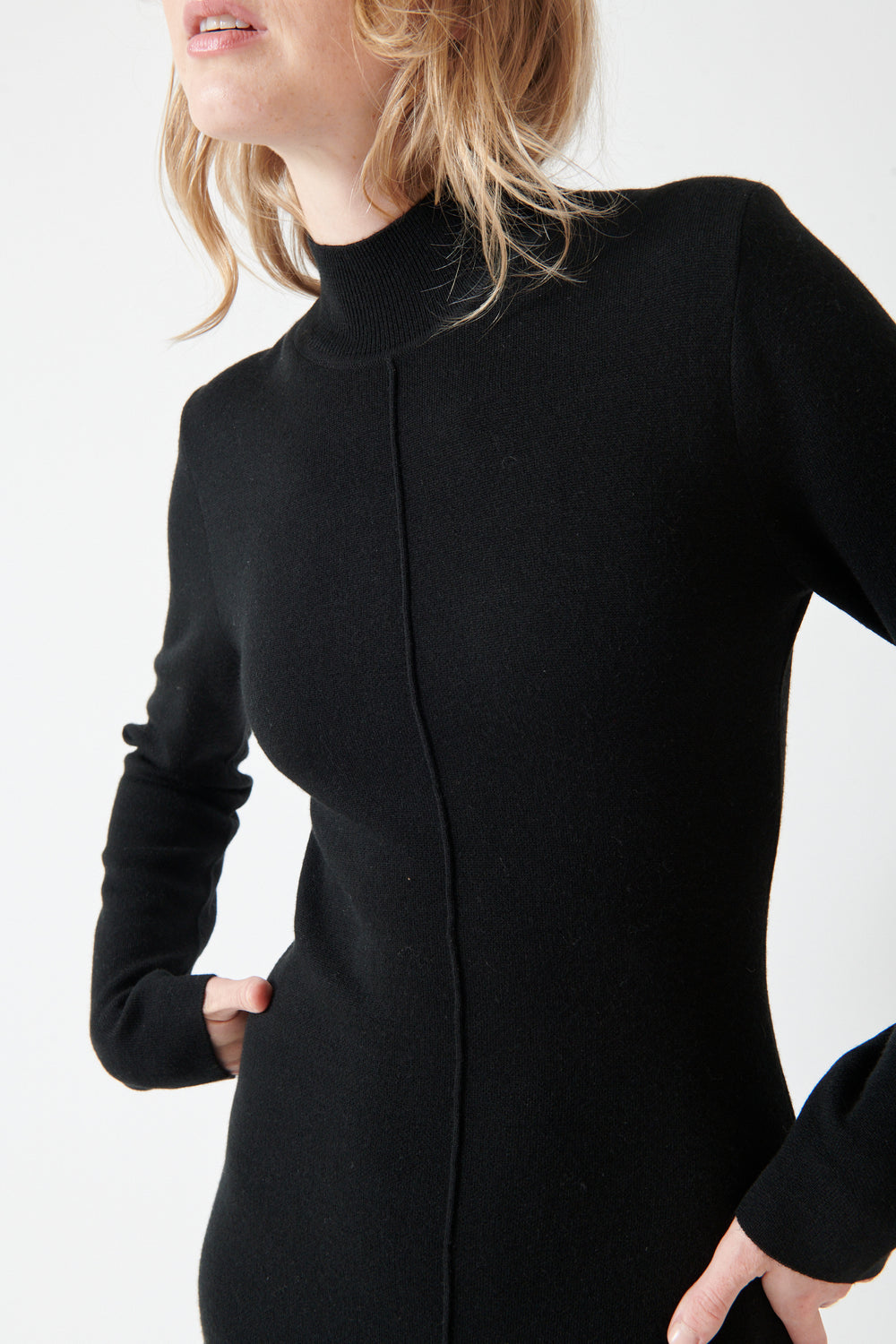 Madi wearing Seventy Long Knit Center Seam High Neck Dress front view