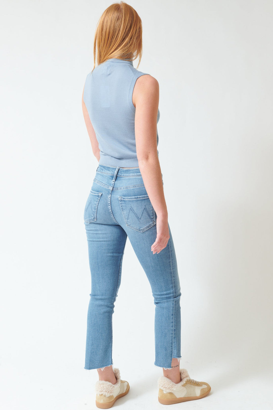 Aysia wearing Mother Denim The Insider Crop Step Fray rear view