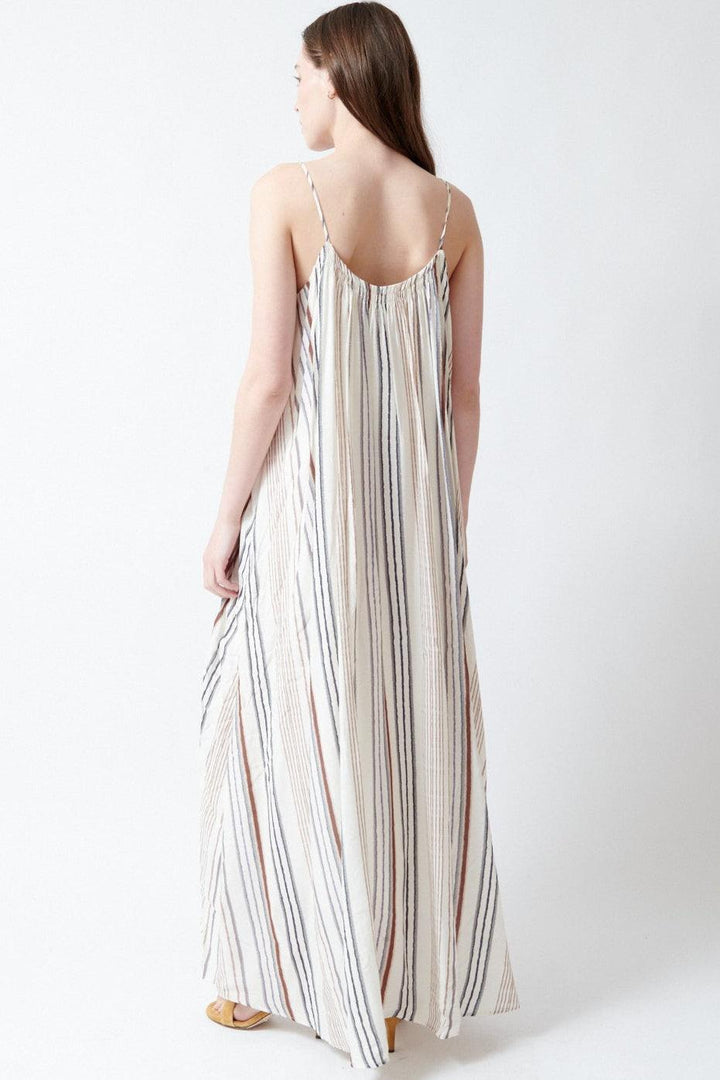Angela wearing ELEH Gulf Striped Dress rear view