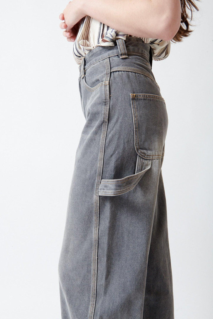 Angela wearing ELEH Ashen Denim Jeans side/detail view