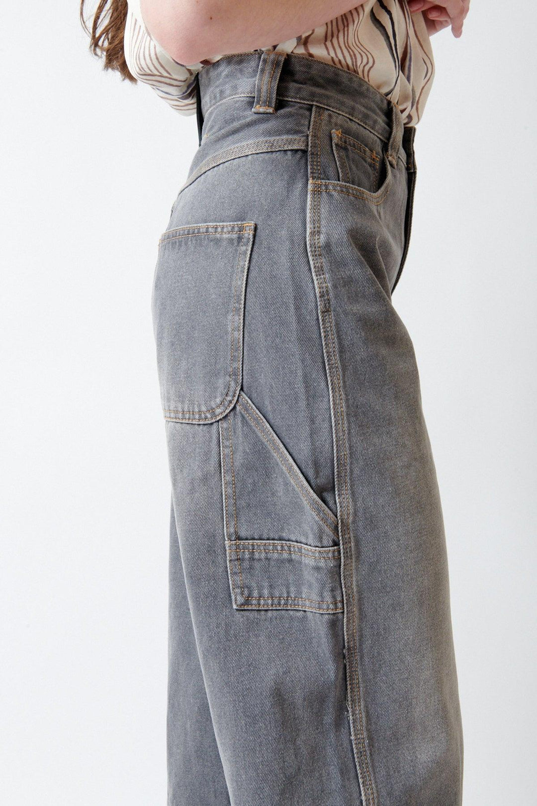 Angela wearing ELEH Ashen Denim Jeans side/detail view
