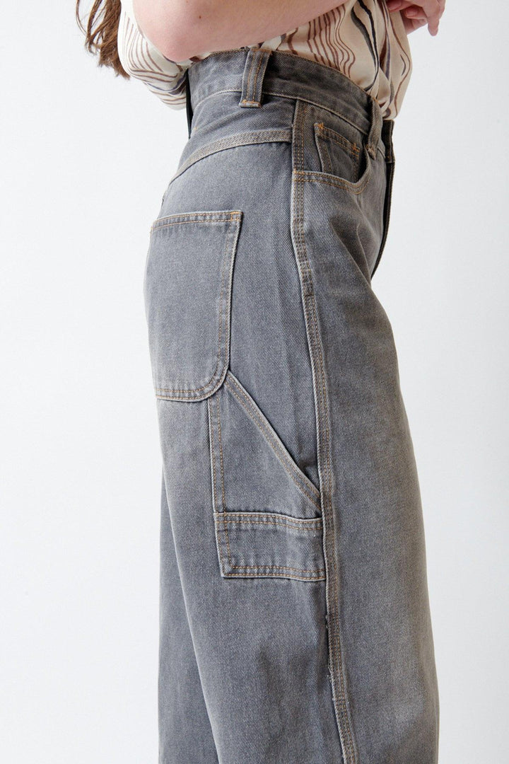 Angela wearing ELEH Ashen Denim Jeans side/detail view