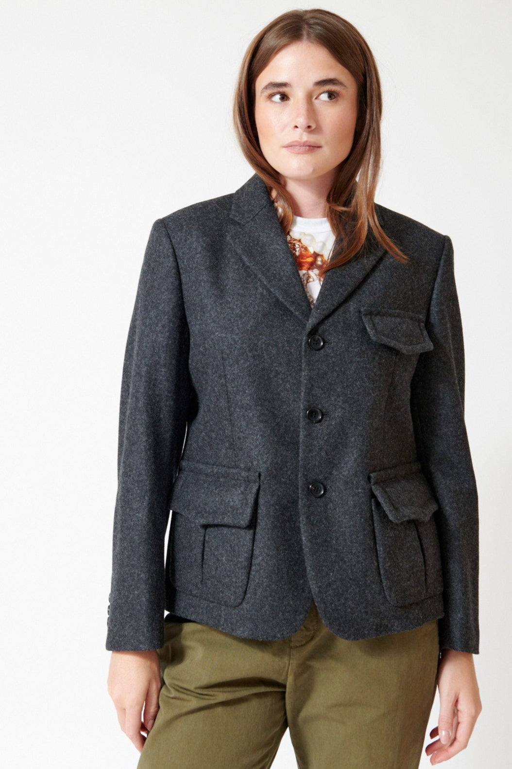 Julia wearing Comme des Garçons Puff Pocket Jacket in Charcoal, front view.