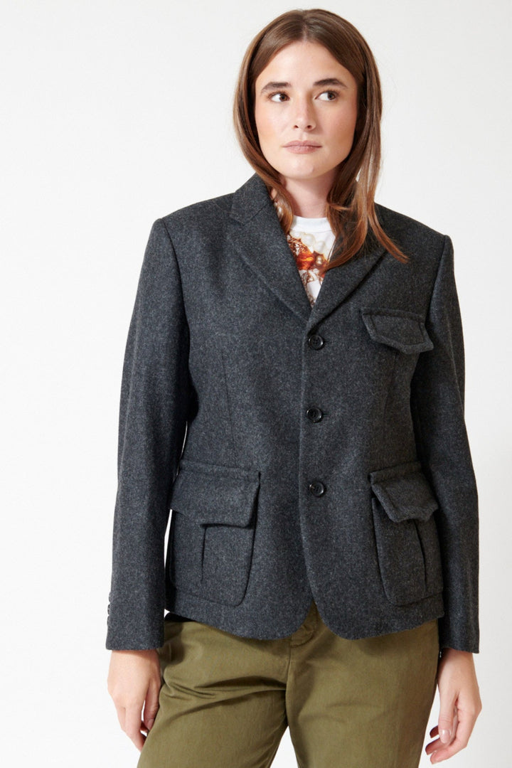Julia wearing Comme des Garçons Puff Pocket Jacket in Charcoal, front view.