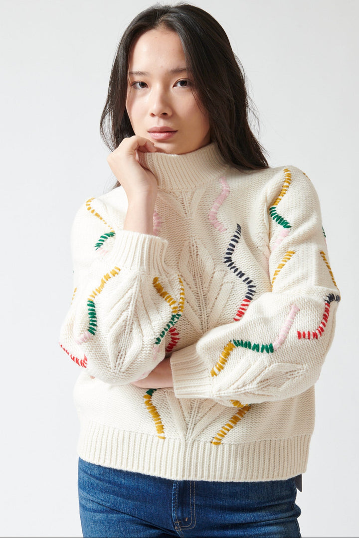 Lilly wearing Jumper 1234 Wool Cashmere Overstitch Cable Turtle front view