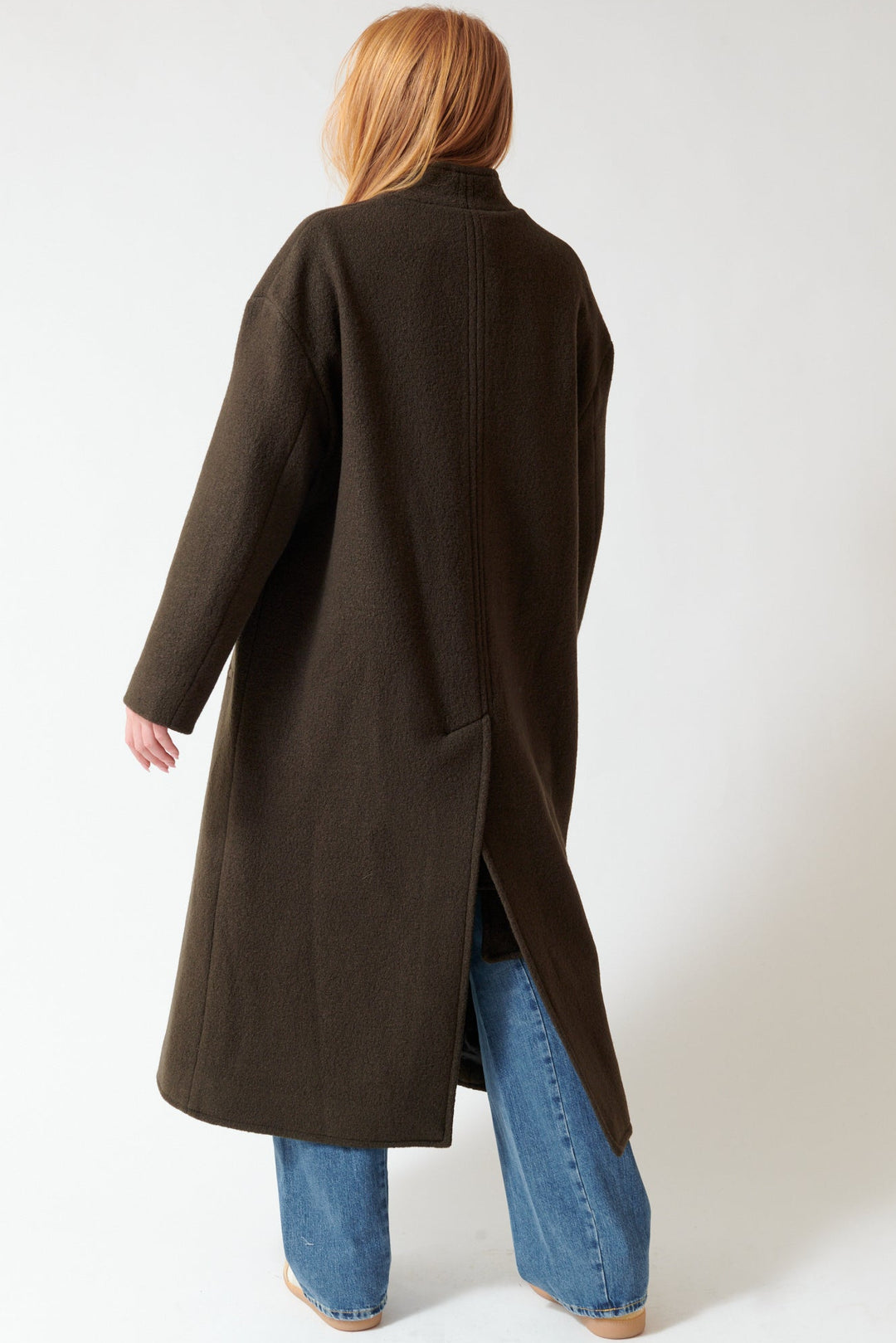 Aysia wearing Apiece Apart Safaa High Neck Coat rear view