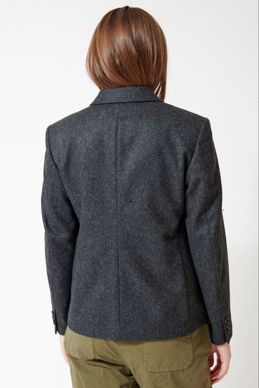 Julia wearing Comme des Garçons Puff Pocket Jacket in Charcoal, rear view.
